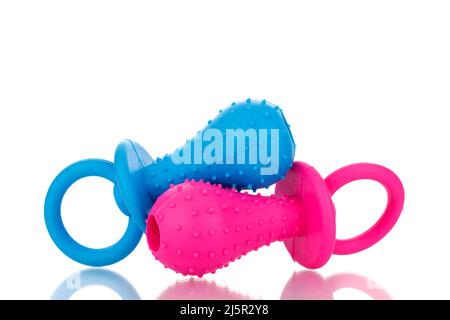 Two rubber toys for dogs, macro, isolated on a white background. Stock Photo