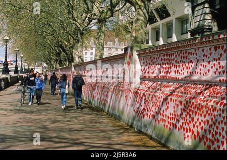 The National Covid Memorial Wall on the South Bank at Westminster, London, with pedestrians