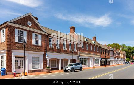 KANNAPOLIS, NC, USA-17 APRIL 2022: A row of offices and shops along the 100 block of Main Street built in early American style. Stock Photo
