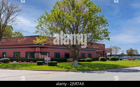 MOORESVILLE, NC, USA-17 APRIL 2022: Simpson World, racing products.  Building and signs.  Sunny, spring day. Stock Photo