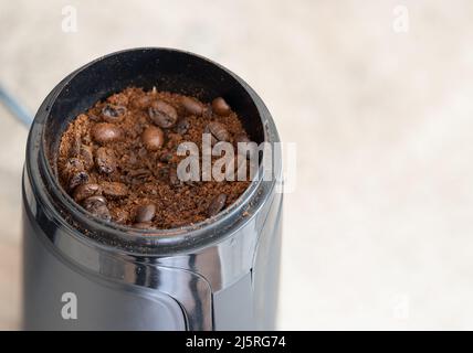 The Process Of Automatic Coffee Grinding In A Coffee Grinder