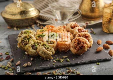 Mix Baklava Dish or Baklawa is Arabic and Turkish Traditional Sweets with Pistachio. Served with Turkish Coffee, Selected Focus Stock Photo