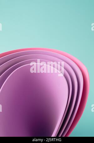 Periwinkle and pink curved sheets on a minty background. Abstract business backdrop Stock Photo