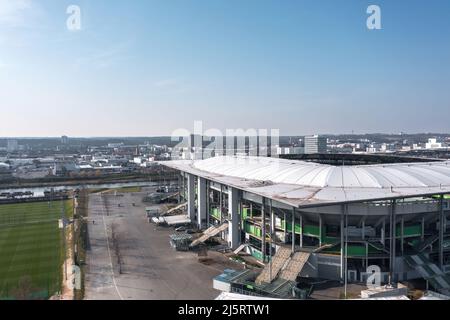 Wolfsburg, Germany - March 2022: Aerial view on Volkswagen Arena and Volkswagen plant industrial area. Cityscape of Wolfsburg. Stock Photo