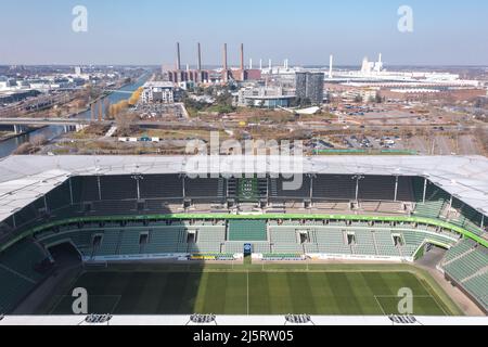 Wolfsburg, Germany - March 2022: Aerial view on Volkswagen Arena and Volkswagen plant industrial area. Cityscape of Wolfsburg. Stock Photo