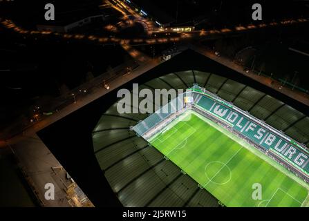 Wolfsburg, Germany - March 2022: Aerial night view on the illuminated Volkswagen Arena stadium after VfL Wolfsburg Bundesliga match Stock Photo