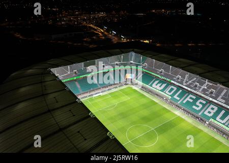 Wolfsburg, Germany - March 2022: Aerial night view on the illuminated Volkswagen Arena stadium after VfL Wolfsburg Bundesliga match Stock Photo