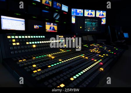 TV Production Switcher in Control Room Stock Photo