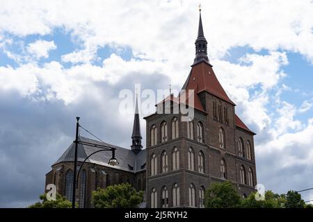 St. Mary's Church in front of a cloudy sky. Famous landmark in the city. Huge old building in gothic architecture. Stock Photo