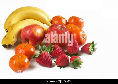 Bananas, apples, strawberries, tangerines from the organic garden. Stock Photo