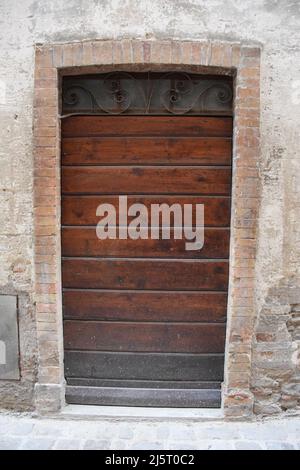 Collection of medieval wooden doors in a very ancient medieval and roman country located in Italy. Stock Photo