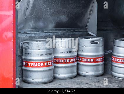 Aluminum beer barrels. Metal beer barrels at the brewery. Shiny metallic beer kegs at delivery truck-December 22,2021-Vancouver BC, Canada. Brand Red Stock Photo