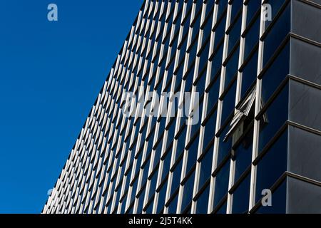 modern building, glass and steel against a blue sky background Stock Photo