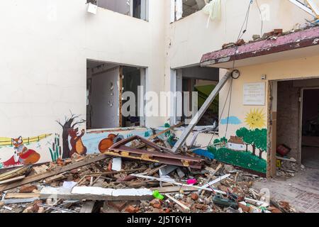 MAKARIV, UKRAINE - Apr. 23, 2022: Destroyed kindergarten as a result of the invasion of Ukraine by the Russian occupation forces. Russians throw air bomb on it at night on March 26 Stock Photo