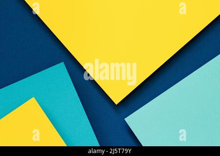 Abstract color papers geometry flat lay composition background with blue and yellow tones Stock Photo