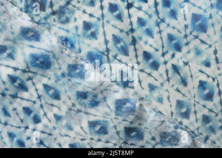 Blue geometric fabric. Pastel blue and white stretch cotton fabric with an abstract pattern Stock Photo