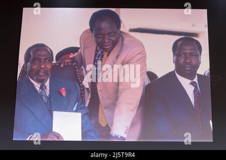 Nairobi, Kenya. 25th Apr, 2022. A photo with 3 former late presidents of Kenya. (L) Jomo Kenyatta, (C) Mwai Kibaki and (R) Daniel Moi at the memorial photo exhibition to honor the late former president within the parliament building during the viewing of the body of late Mwai Kibaki at the Kenyan parliament. Kenyans got an opportunity to view and give last respect to the body of former Kenya president the late Mwai Kibaki which is lying at the Kenyan parliament. The former president passed away on 22 April 2022 at the age of 90. Credit: SOPA Images Limited/Alamy Live News Stock Photo