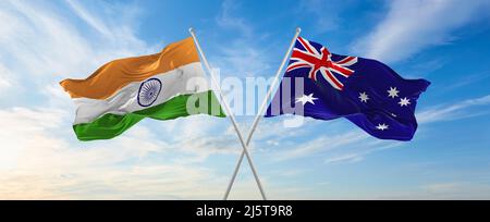 crossed national flags of India and Australia flag waving in the wind ...