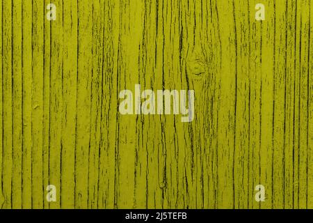 Texture of old painted wooden surface with yellow paint. Bright wooden table. Copy Space. Stock Photo