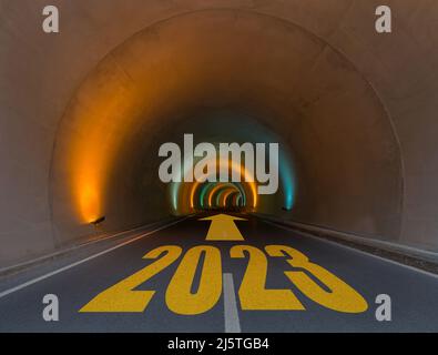 New Year 2023 Goals and Plans Concept. Number 2023 on the empty asphalt tunnel road. Anniversary concept. Stock Photo