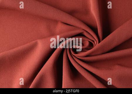 Red silk luxury drapery fabric texture background closeup Stock Photo