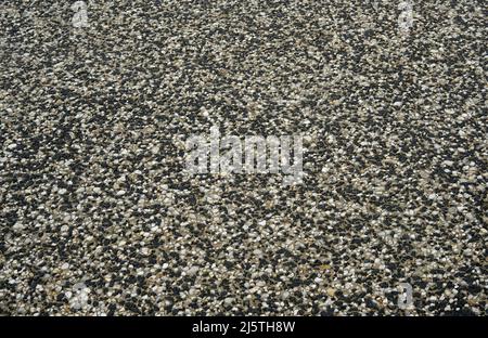 Exposed aggregate concrete driveway a close up view Stock Photo