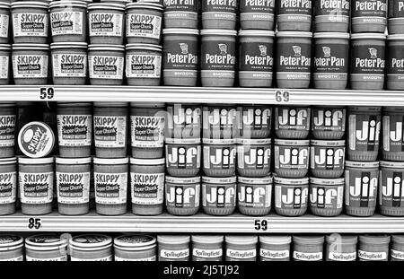 Classic brands of peanut butter on a shelf in supermarket circa 1970s. Stock Photo