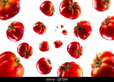 Collection of pachino tomato falling isolated on white background. Selective focus Stock Photo