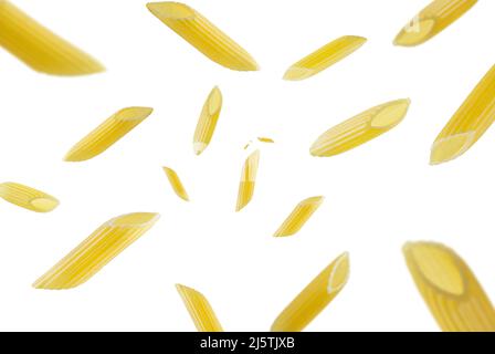 Collection of Italian Pasta penne rigate falling isolated on white background. Selective focus Stock Photo