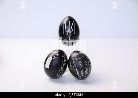 Defocus black eggs on white background. Minimal Easter celebration concept. Design, visual art, minimalism. Balance and harmony concept. Mental health Stock Photo