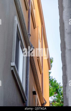 Low angle view of a building with drain pipe on the wall in San Francisco, California Stock Photo