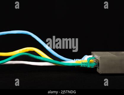Ethernet Network Cables plugged into internet router Stock Photo
