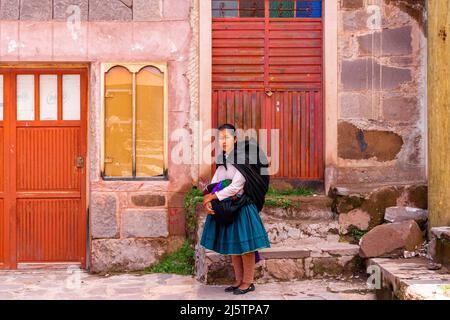 A Young Taquileno Woman In Traditional Costume, Taquile Island, Lake Titicaca, Puno, Peru. Stock Photo