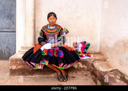 A Young Taquileno Woman In Traditional Costume, Taquile Island, Lake Titicaca, Puno, Peru. Stock Photo