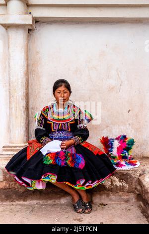 A Young Taquileno Woman In Traditional Costume, Taquile Island, Lake Titicaca, Puno, Peru. Stock Photo