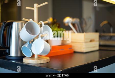 Hanging grass cookware set on table in wooden box Stock Photo