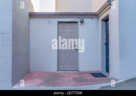 Two front doors with red concrete entrance in San Francisco, California Stock Photo