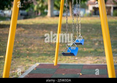 Playground swing set, selective focus. Empty, no people. Stock Photo