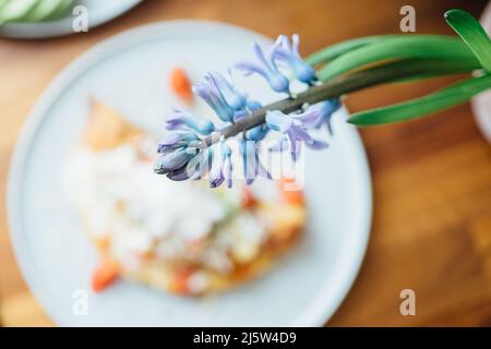 Spring bouquet of flowers close-up on the table during breakfast. Stock Photo