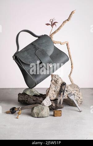 Still life with leather handbag and tools. Stock Photo