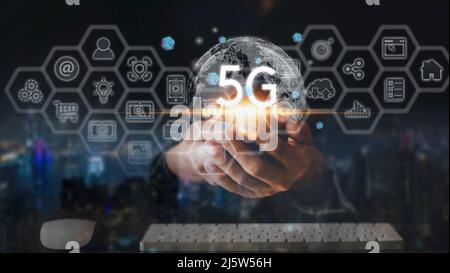 Hand of business man.Global network connection 5G with icon concept, technology network wireless systems and internet of things, new technologies comi Stock Photo