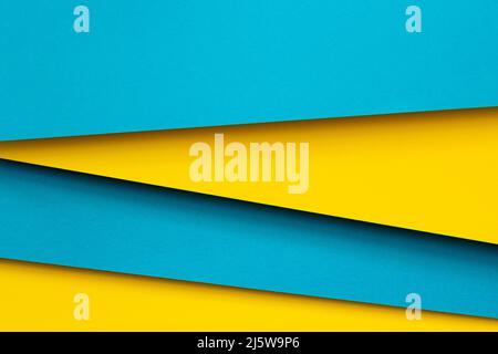 Abstract color papers geometry flat lay composition background with blue and yellow tones Stock Photo