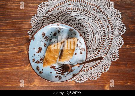 Turkish or Bosnian dessert called Baklava with on a wooden board. Popular dessert for Ramadan and Eid Mubarak Stock Photo