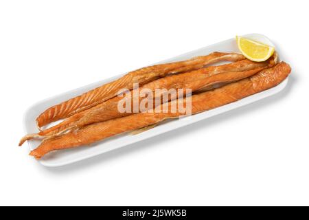 Fresh smoked salmon bellies on a plate close up isolated on white background Stock Photo