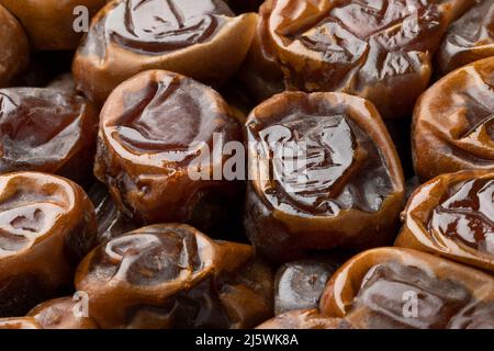 Traditional Arabic Sukari dates close up full frame as background Stock Photo