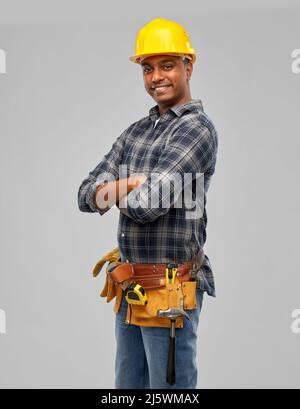 happy indian worker or builder with crossed arms Stock Photo