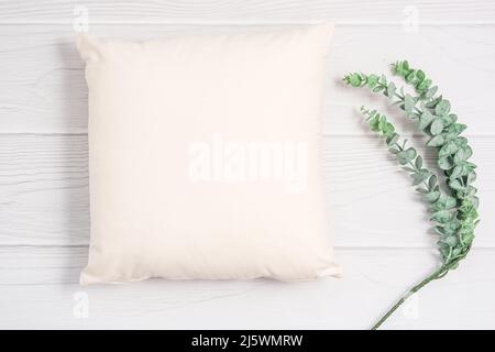 White pillow blank mockup on light wood background Stock Photo