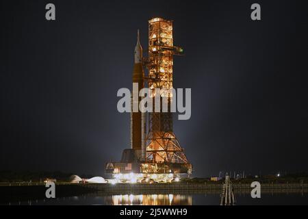 NASA's SLS Booster rolls back to the Vehicle Assembly Building at the Kennedy Space Center, Florida on Tuesday, April 26, 2022. NASA plans to conduct repairs to the rocket and its mobile launch platform before returning to the pad for a wet dress rehearsal and tanking test. Photo by Joe Marino/UPI Credit: UPI/Alamy Live News Stock Photo