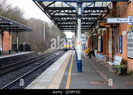 Containers pass through Melton Mowbray Railway Station Stock Photo