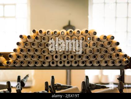 Machines in an old cotton mill. Stock Photo